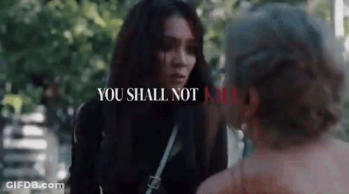 Woman Talking To Man In Park Saying You Shall Not Kill GIF