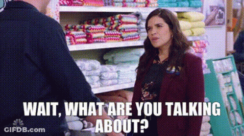 Woman Talking To Man In Store Next To Towel Shelf GIF