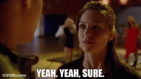Woman Talking To Man Saying Yeah Yeah Sure GIF