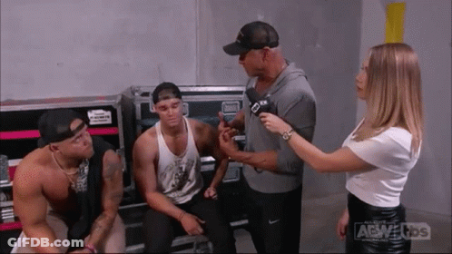 Woman Talking To Man With Microphone GIF