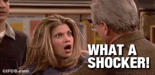 Woman Talking To Shocked Man Saying What A Shocker GIF