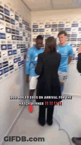 Woman Talking To Two Soccer Players In Room Saying 1000 Boiled Eggs On Arrival For The Match Winner GIF
