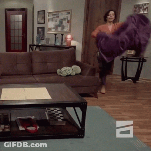 Woman Throwing Purple Blanket GIF