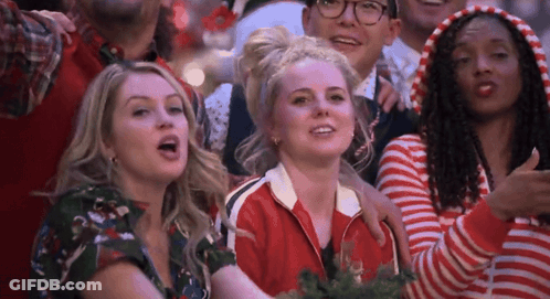 Woman Thumbs Up In Crowd GIF