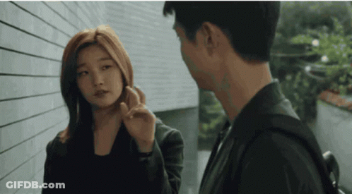 Woman Touching Man's Face GIF