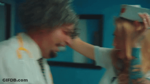 Woman Touching Man's Face In Hospital Room GIF