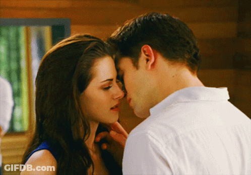 Woman Touching Man's Forehead While Kissing GIF