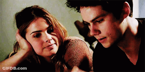 Woman Touching Man's Head Looking At Each Other GIF