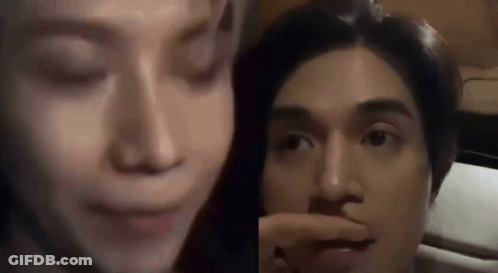 Woman Touching Man's Nose Sitting Together GIF