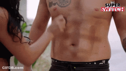 Woman Touching Shirtless Man's Stomach GIF
