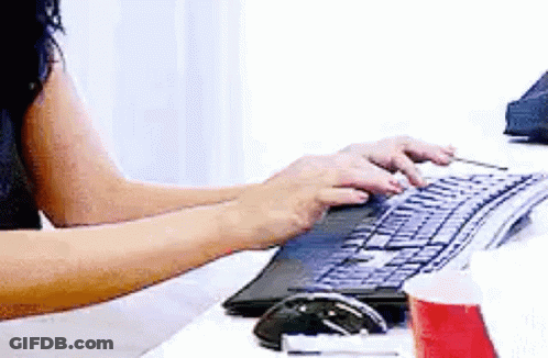 Woman Typing On Computer Keyboard GIF