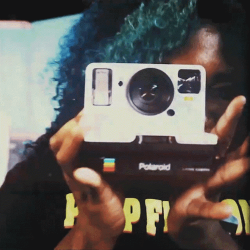 Woman Using A Polaroid Camera GIF