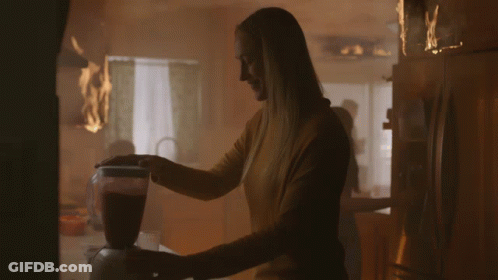 Woman Using Blender In Kitchen With Fire GIF
