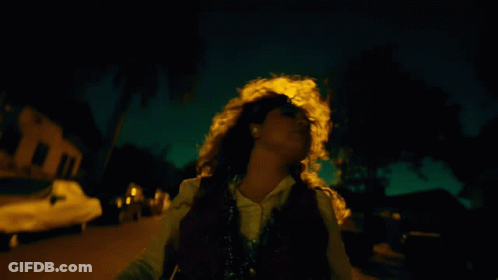 Woman Walking At Night With Yellow Headlight GIF