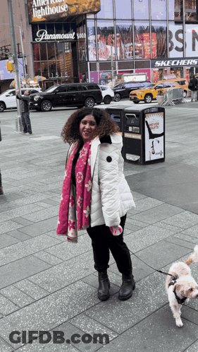 Woman Walking Dog In Front Of Paramount GIF