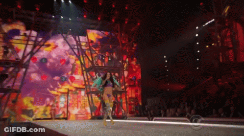Woman Walking Down Runway At Fashion Show GIF