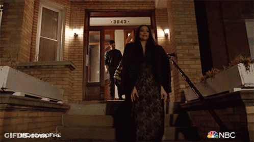 Woman Walking Down Stairs At Brick Building 3083 GIF