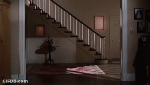 Woman Walking Down Stairs GIF