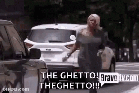 Woman Walking Down Street Talking On Cell Phone GIF