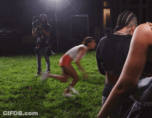Woman Walking In Field With Zee On Shoulder GIF
