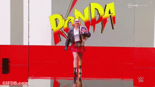 Woman Walking In Front Of Ronda Logo GIF