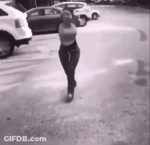 Woman Walking In Parking Lot GIF