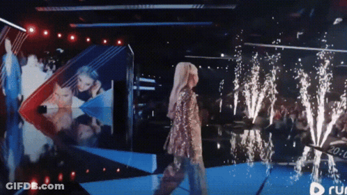 Woman Walking On Stage With Run Logo GIF