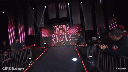 Woman Walking Runway In Front Of Subscribe Screen GIF