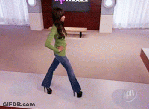 Woman Walking Runway In Front Of Top Model Sign GIF