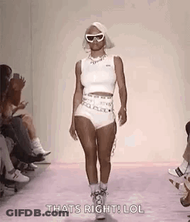 Woman Walking Runway In Sunglasses GIF