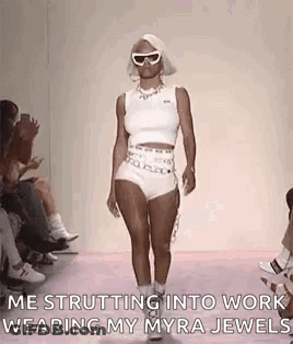 Woman Walking Runway In White Top And Shorts GIF