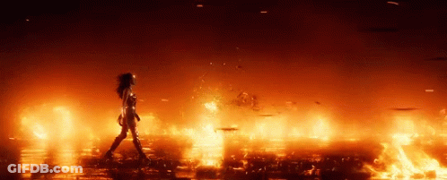 Woman Walking Through Burning Field GIF