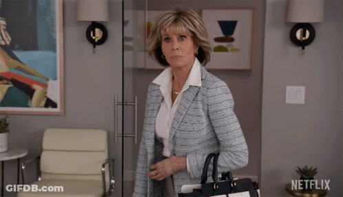 Woman Walking Through Glass Door Netflix Logo GIF