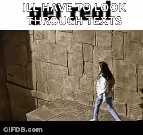 Woman Walking Through Maze Looking At Texts GIF