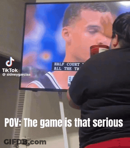 Woman Watching Half-Court Basketball Game On TV GIF