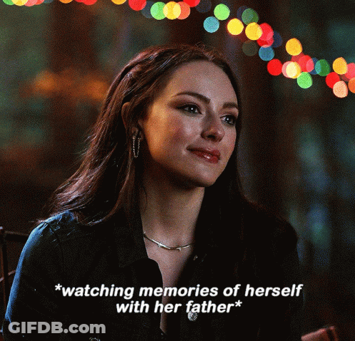 Woman Watching Memories Of Herself With Her Father GIF