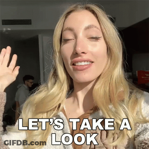 Woman Waving Hand Saying Let's Take A Look GIF