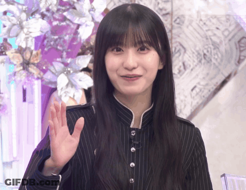 Woman Waving In Striped Shirt GIF