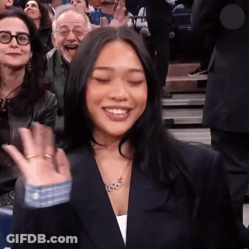 Woman Wearing 3333 Necklace Smiling GIF