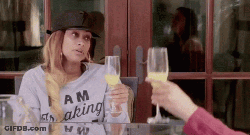 Woman Wearing Am Making Shirt Holding Orange Juice GIF