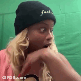 Woman Wearing Black Beanie With Embroidered Word GIF