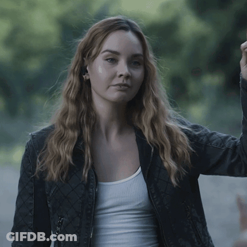 Woman Wearing Black Jacket And White Tank Top Gotcha GIF