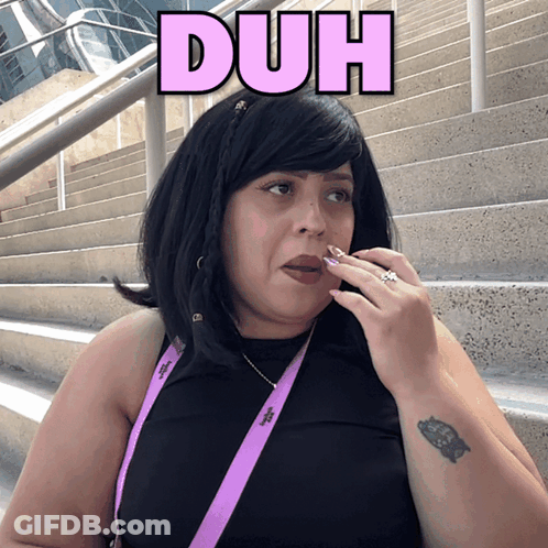 Woman Wearing Black Shirt And Duh Lanyard GIF