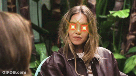 Woman Wearing Brown Leather Jacket With Red Glasses GIF
