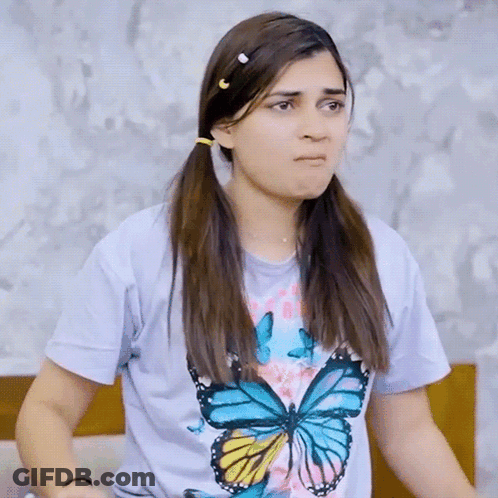Woman Wearing Butterfly T-Shirt Making Funny Face GIF