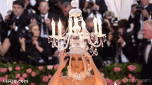 Woman Wearing Chandelier Headpiece GIF