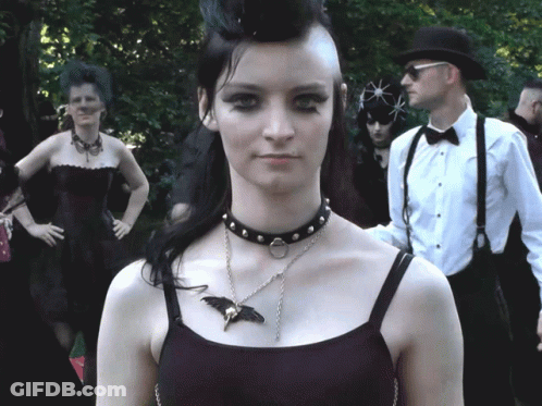 Woman Wearing Choker And Bat Necklace GIF