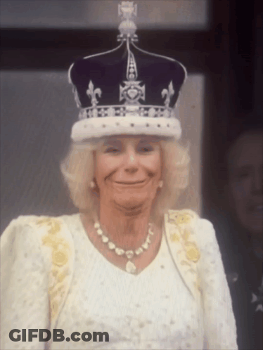 Woman Wearing Crown And Pearl Necklace Smiling GIF