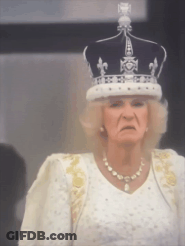 Woman Wearing Crown And White Dress Making Funny Face GIF