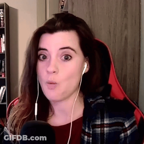Woman Wearing Ear Buds And Plaid Shirt Surprised GIF